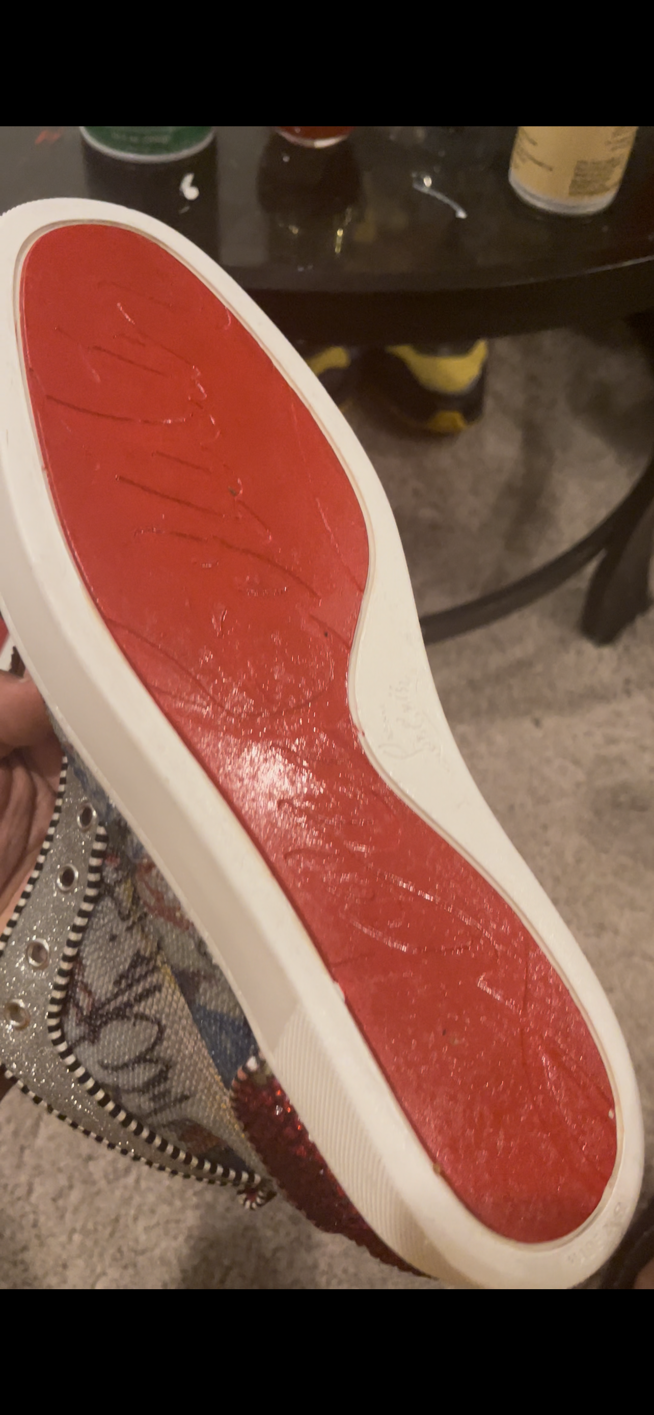 Red-bottom sneaker outsole after repaint restoration